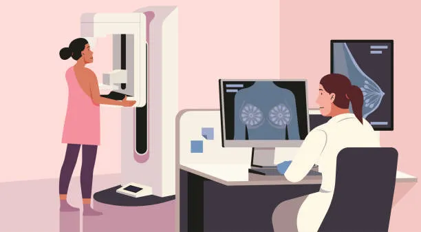 Woman undergoing an MRI scan: a patient stands beside a large MRI machine while a radiologist reviews MRI images on a computer monitor nearby.